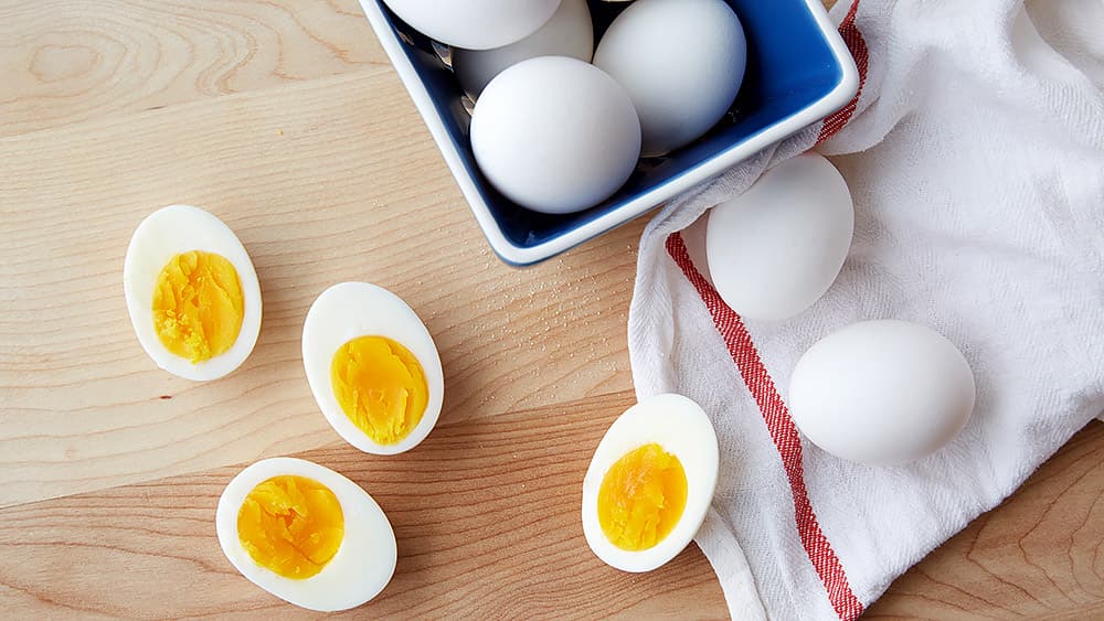 Several Boiled Eggs and some boiled eggs cut in half