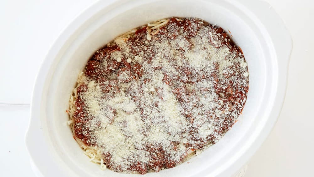 Layer 3 lasagna noodles over the sauce in the slow cooker