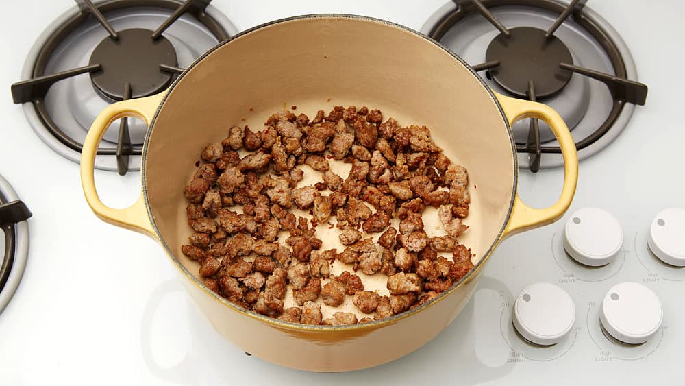 Cook sausage over medium-high heat until no longer pink